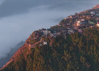 Aerial View of Nongjrong Village Above Sea of Clouds in Meghalaya