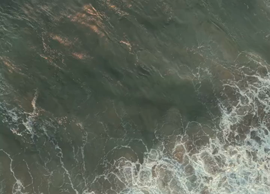 Aerial View of Ocean Waves Crashing on Beach Kerala India