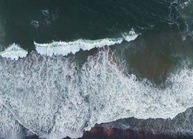 Aerial View of Ocean Waves Crashing on Beach Kerala India