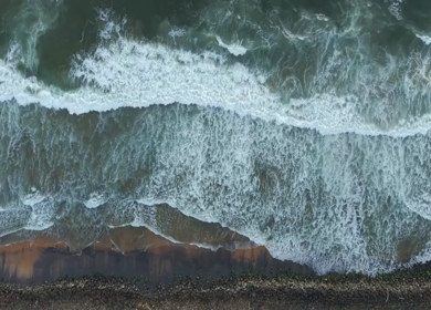 Aerial View of Ocean Waves Crashing on Beach Kerala India