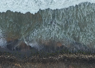 Aerial View of Ocean Waves Crashing on Beach Kerala India