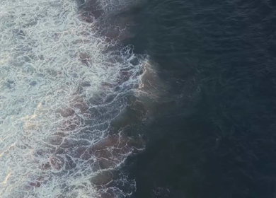 Aerial View of Ocean Waves Crashing on Beach Kerala India