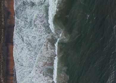 Aerial View of Ocean Waves Crashing on Beach Kerala India