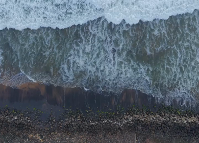 Aerial View of Ocean Waves Crashing on Beach Kerala India