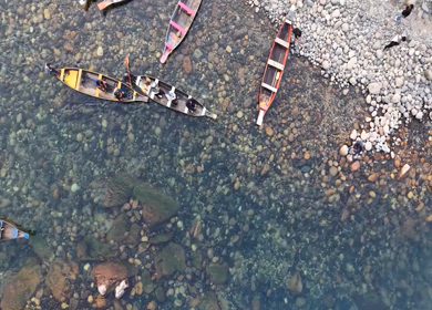 Aerial View of People Enjoying Boat Ride on Crystal Clear Umngot River in Dawki Meghalaya India