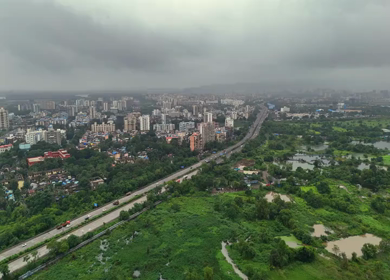 Aerial View of Pune City with Green Hills and Monsoon Landscape Maharashtra India