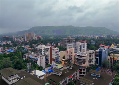 Aerial View of Pune City with Green Hills and Monsoon Landscape Maharashtra India