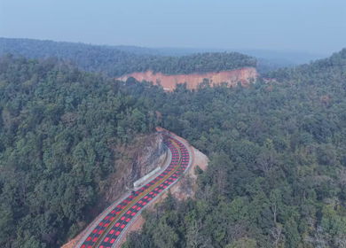 Aerial View of Red Wildlife Highway Through Forest in Madhya Pradesh India