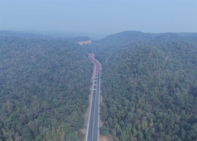 Aerial View of Red Wildlife Highway Through Forest in Madhya Pradesh India