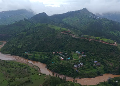 Aerial View of River Valley, Forested Hills and Mountain Lodges in Almora, Uttarakhand