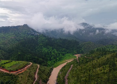 Aerial View of River Valley, Forested Hills and Mountain Lodges in Almora, Uttarakhand