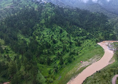 Aerial View of River Valley, Forested Hills and Mountain Lodges in Almora, Uttarakhand