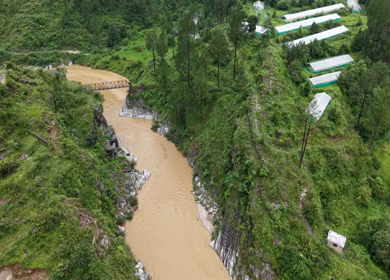 Aerial View of River Valley, Forested Hills and Mountain Lodges in Almora, Uttarakhand