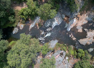 Aerial View of Rocky Stream and Lush Forest Landscape Pratapgarh Rajasthan India