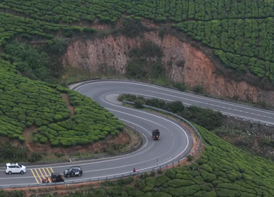 Aerial View of Scenic Mountain Roads and Tea Plantations in Munnar, Kerala, India