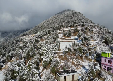 Aerial View of Snow Covered Village Houses in Brahmatal Uttarakhand India