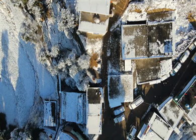 Aerial View of Snow Covered Village Houses in Brahmatal Uttarakhand India