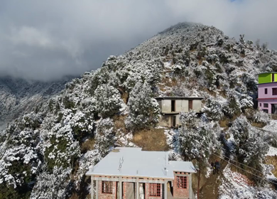 Aerial View of Snow Covered Village Houses in Brahmatal Uttarakhand India
