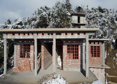 Aerial View of Snow Covered Village Houses in Brahmatal Uttarakhand India