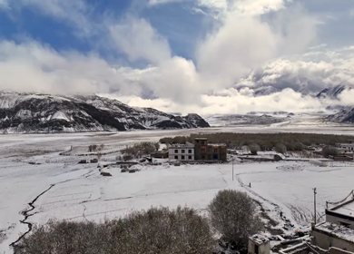 Aerial View of Snow Covered Village and Himalayan Mountains in Ladakh India