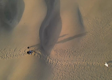 Aerial View of Tourists Enjoying Camel Ride in Jaisalmer Thar Desert Rajasthan India