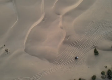 Aerial View of Tourists Enjoying Jeep Safari in Sand Dunes Jaisalmer Thar Desert India
