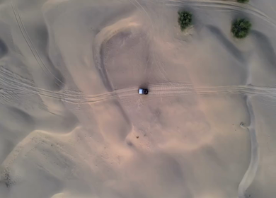 Aerial View of Tourists Enjoying Jeep Safari in Sand Dunes Jaisalmer Thar Desert India