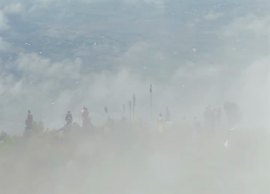 Aerial View of Tourists Standing on Kondarangi Hills Peak in Misty Clouds Tamil Nadu