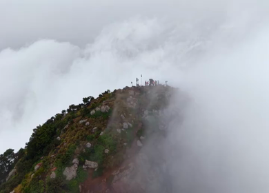 Aerial View of Tourists Standing on Kondarangi Hills Peak in Misty Clouds Tamil Nadu