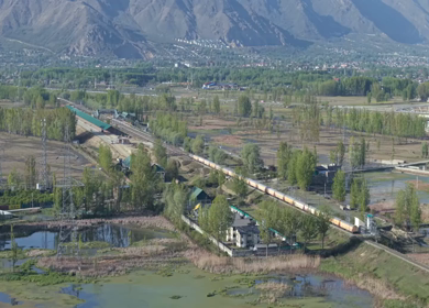 Aerial View of Train Passing Pampore Station in Srinagar Kashmir