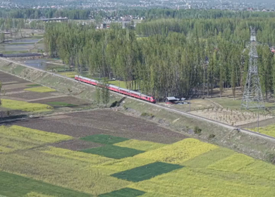Aerial View of Train Passing Pampore Station in Srinagar Kashmir