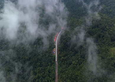 Aerial View of Train Passing Through Misty Forest in Kanyakumari Tamil Nadu