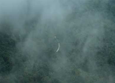 Aerial View of Train Passing Through Misty Forest in Kanyakumari Tamil Nadu