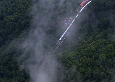 Aerial View of Train Passing Through Misty Forest in Kanyakumari Tamil Nadu