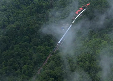 Aerial View of Train Passing Through Misty Forest in Kanyakumari Tamil Nadu