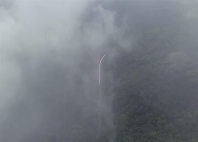 Aerial View of Train Passing Through Misty Forest in Kanyakumari Tamil Nadu
