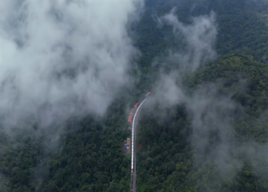 Aerial View of Train Passing Through Misty Forest in Kanyakumari Tamil Nadu