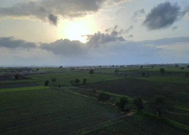 Aerial View of Train Passing Through Agricultural Fields in Tumkur India
