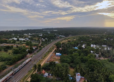 Aerial View of Train and Coastal Landscape with Mountains in Kanyakumari Tamil Nadu