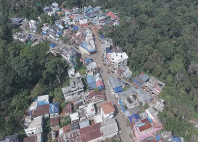 Aerial View of Tropical Town and Dense Forest in Kerala India