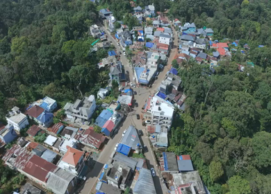 Aerial View of Tropical Town and Dense Forest in Kerala India