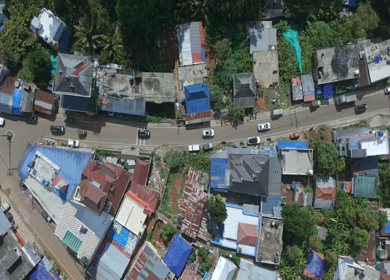 Aerial View of Tropical Town and Dense Forest in Kerala India