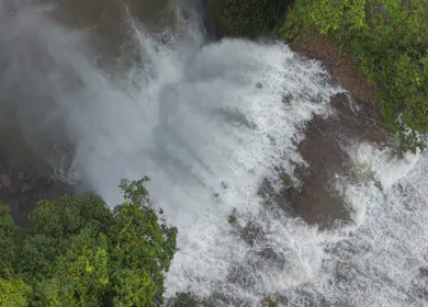 Aerial View of Waterfall in Misty Green Hills of Maharashtra