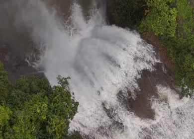 Aerial View of Waterfall in Misty Green Hills of Maharashtra