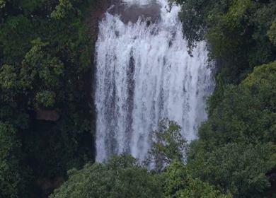 Aerial View of Waterfall in Misty Green Hills of Maharashtra