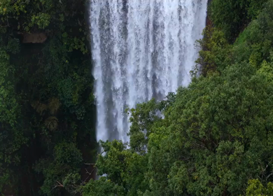 Aerial View of Waterfall in Misty Green Hills of Maharashtra
