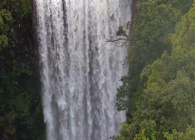 Aerial View of Waterfall in Misty Green Hills of Maharashtra