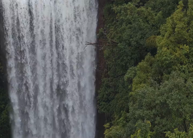 Aerial View of Waterfall in Misty Green Hills of Maharashtra