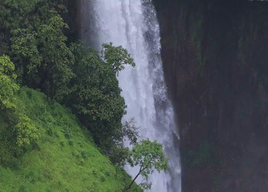 Aerial View of Waterfall in Misty Green Hills of Maharashtra
