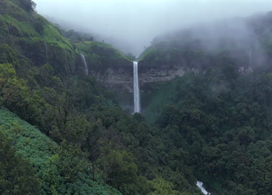 Aerial View of Waterfall in Misty Green Hills of Maharashtra